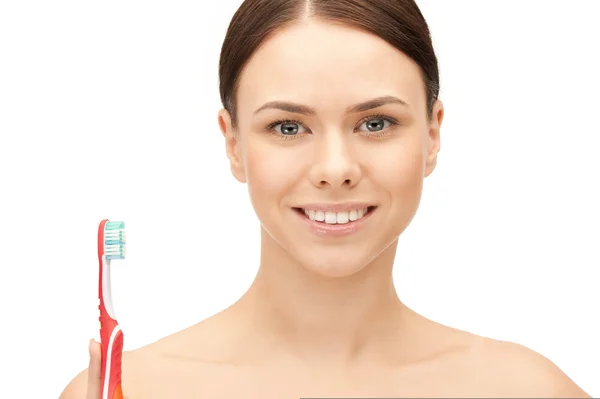 Diş fırçası ile güzel bir kadın — Stok fotoğraf