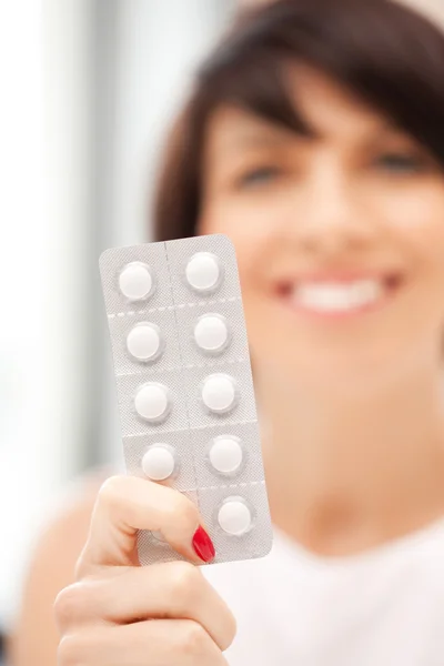 Young beautiful woman with pills — Stock Photo, Image
