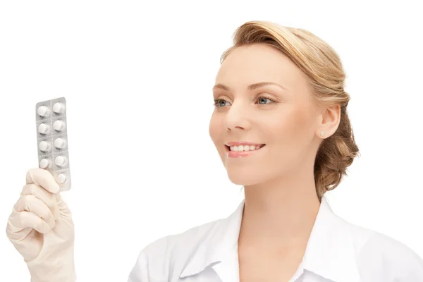 Attractive female doctor with pills — Stock Photo, Image