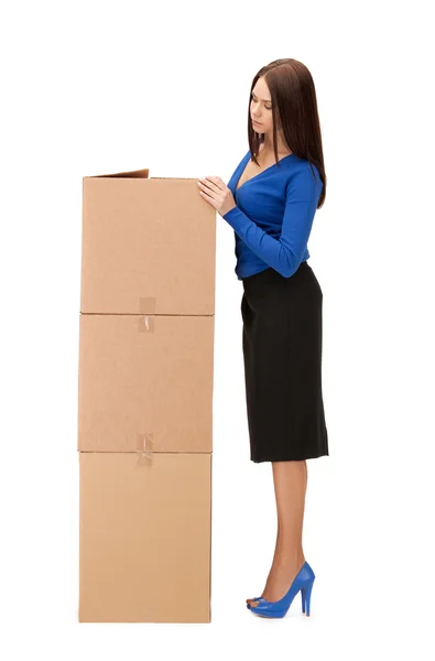 Attractive businesswoman with big boxes — Stock Photo, Image