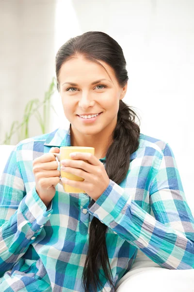 Lovely housewife with mug — Stock Photo, Image