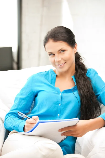 Happy woman with big notepad — Stock Photo, Image
