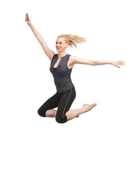 Jumping sporty girl — Stock Photo, Image