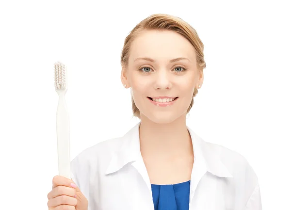 Doktor diş fırçası ile — Stok fotoğraf