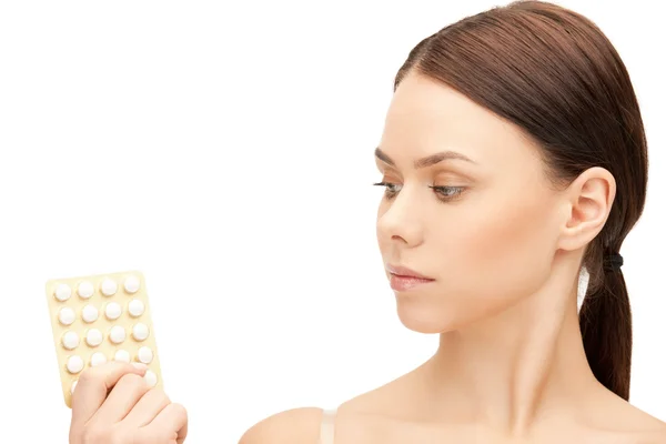 Young beautiful woman with pills — Stock Photo, Image