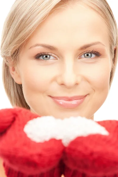 Woman in mittens with snow — Zdjęcie stockowe