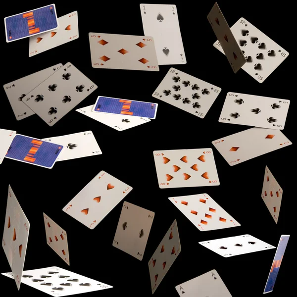 Flying cards on black background — Stock Photo, Image