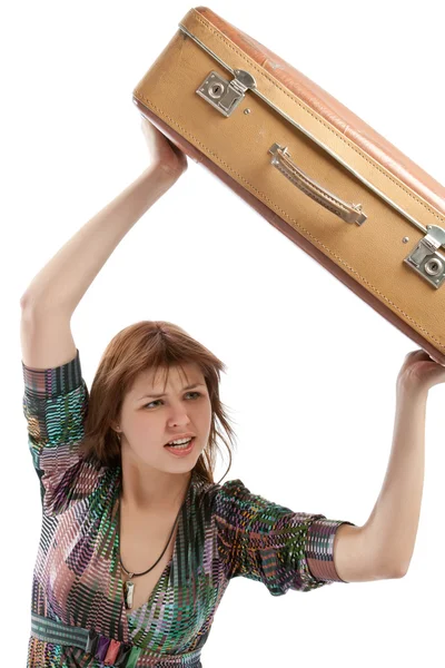 Female throwing a suitcase — Stock Photo, Image