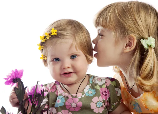 Cute girl whispering something to her sister — Stock Photo, Image