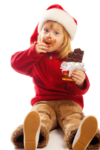 Menina comendo chocolate — Fotografia de Stock