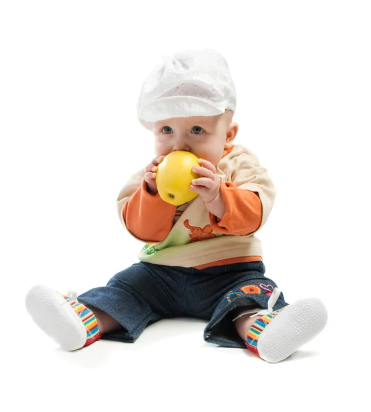 Bebé muerde una manzana — Foto de Stock