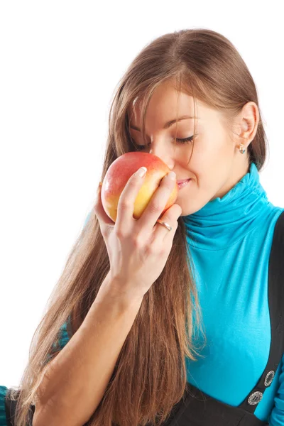 Girl smelling an apple — Stock Photo, Image