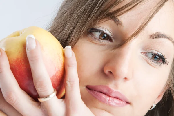 Woman with an apple in hand — Stock Photo, Image