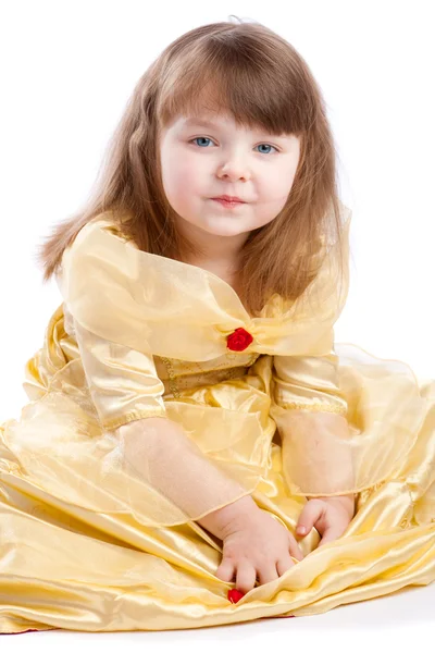 Menina bonito em vestido dourado — Fotografia de Stock