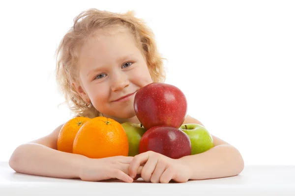 Girl with apples and oranges — Stock Photo, Image