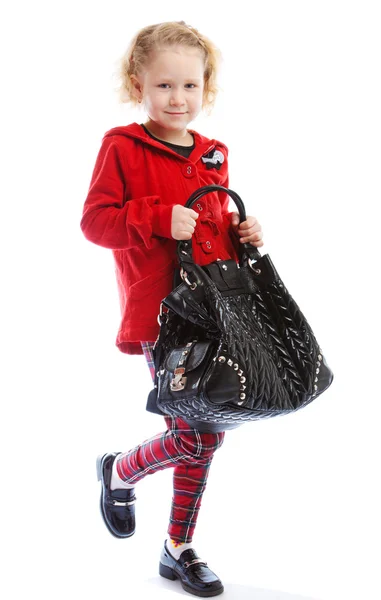 Menina segurando uma bolsa — Fotografia de Stock
