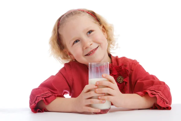 Dívka se sklenicí mléka — Stock fotografie