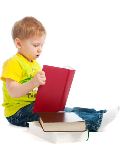 Boy reading books — Stok fotoğraf