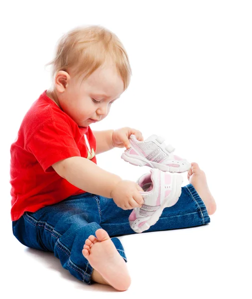 Baby trying on trainers — Stock Photo, Image