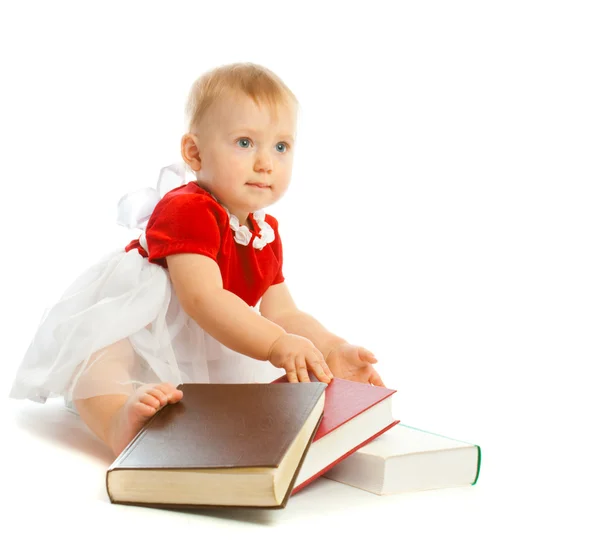 Baby with books — Stockfoto