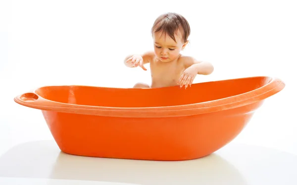Baby beside bathtub — Stock Photo, Image