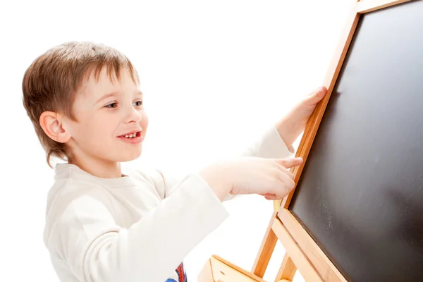 Boy at blackboard — Stock Photo, Image