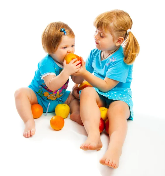 Kids eating apples Stock Image