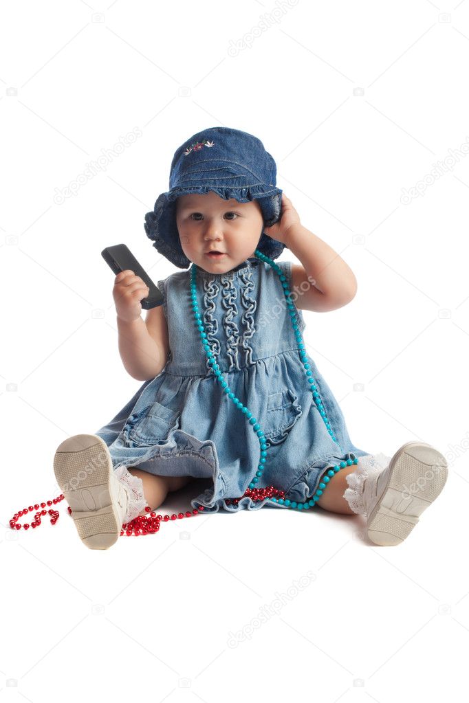 Cute kid in blue dress and hat, isolated