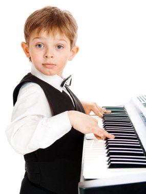 Boy playing piano clipart