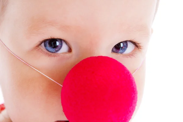 Baby met clowns neus — Stockfoto