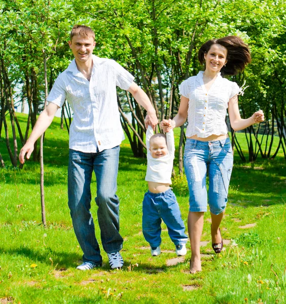 Family in the summer park — Stock Photo, Image