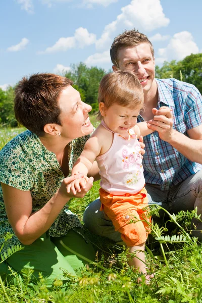 Family in the meadow — Stock Photo, Image