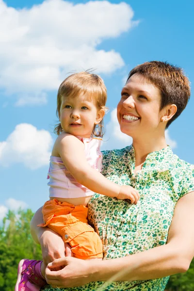 Happy mother holding daughter — Stock Photo, Image