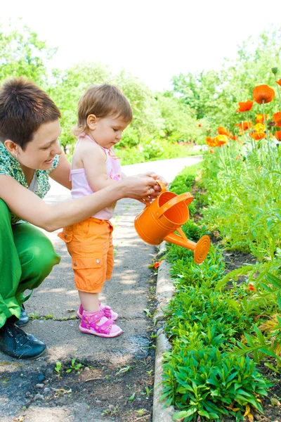 Mom and baby in garden — Stock Photo, Image