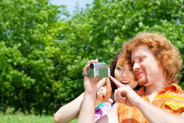 Couple with camcorder — Stock Photo, Image