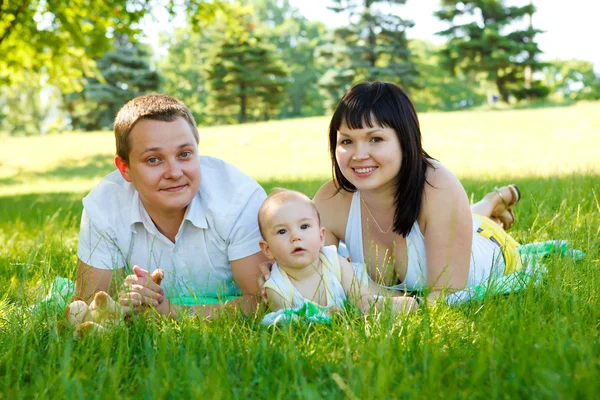Mom, dad and son in park — Stock Photo, Image