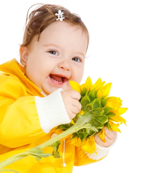 Skrattande bebis med solros — Stockfoto