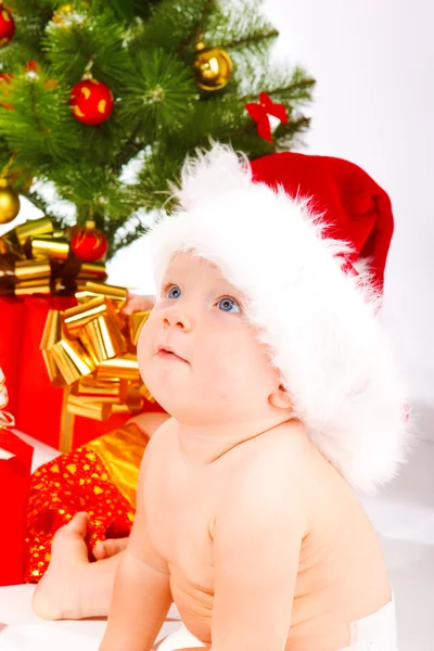 Baby in xmas hat Stock Picture