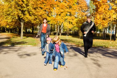 Parents and kids in park clipart