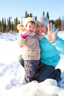 Woman and girl in snow clipart