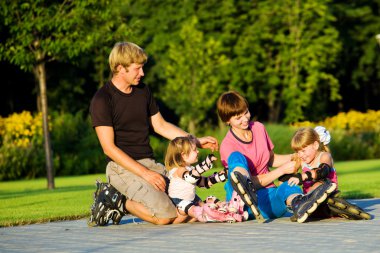 Family in roller skates clipart