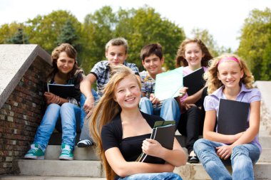 Teenagers with books clipart