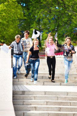 Students running down the stairway clipart
