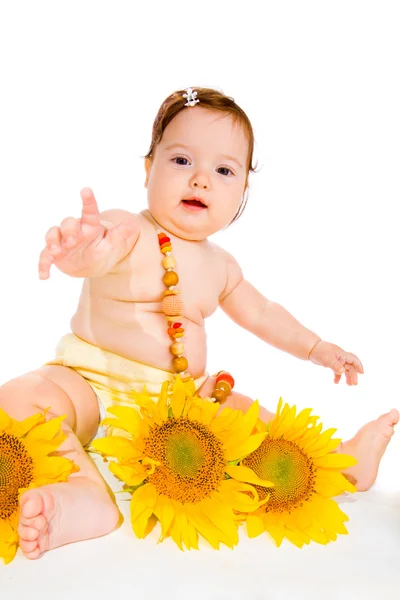 Ayçiçeği ile kız bebek — Stok fotoğraf