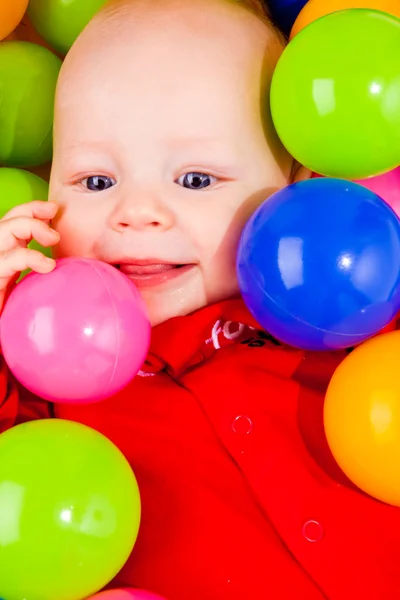 Cheerful baby with balls — Stock Photo, Image