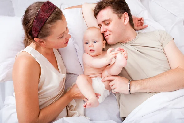 Cheerful family in bed — Stock Photo, Image