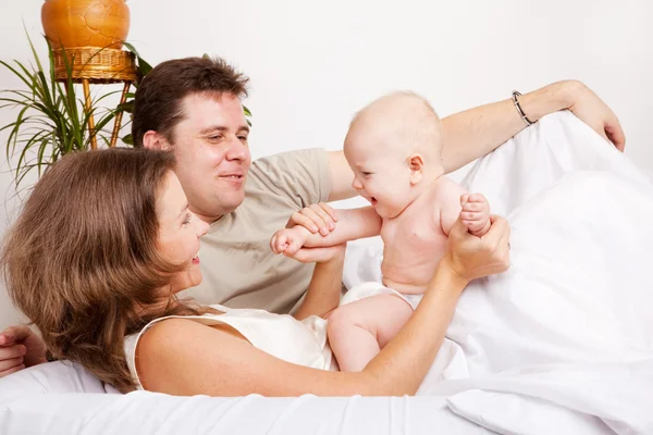 Lovely family in bed — Stock Photo, Image