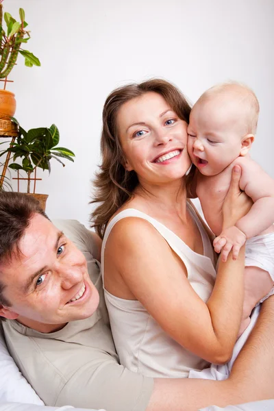 Cheerful parents and a baby — Stock Photo, Image