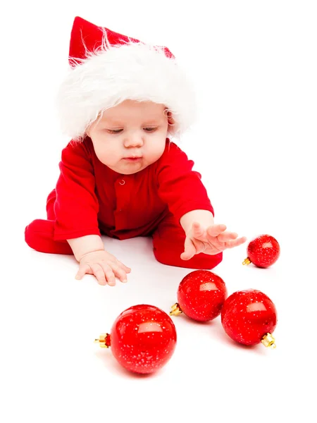Noel dekorasyonu ile oynayan bebek — Stok fotoğraf