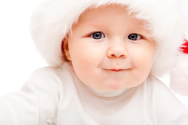 Baby in a large Santa hat — Stock Photo, Image